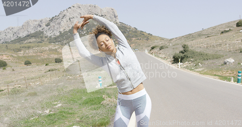 Image of Young content woman in sportive outfit