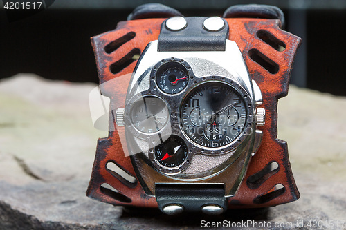 Image of watches with several dials and leather bracelet