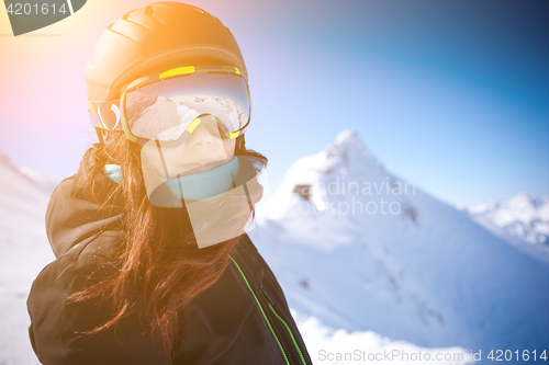 Image of Woman in helmet among mountains