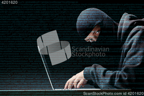 Image of Hacker selects code to computer