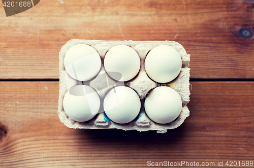 Image of close up of white eggs in egg box or carton