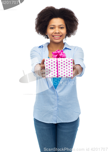 Image of happy african woman with birthday gift box