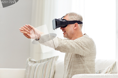 Image of old man in virtual reality headset or 3d glasses