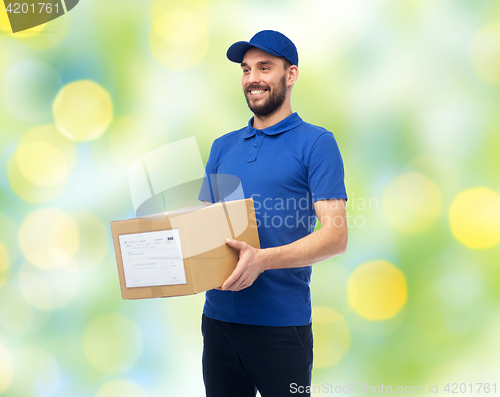 Image of happy delivery man with parcel box