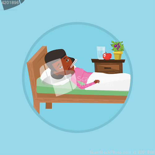 Image of Sick woman with thermometer laying in bed.