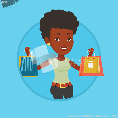 Image of Happy woman holding shopping bags.