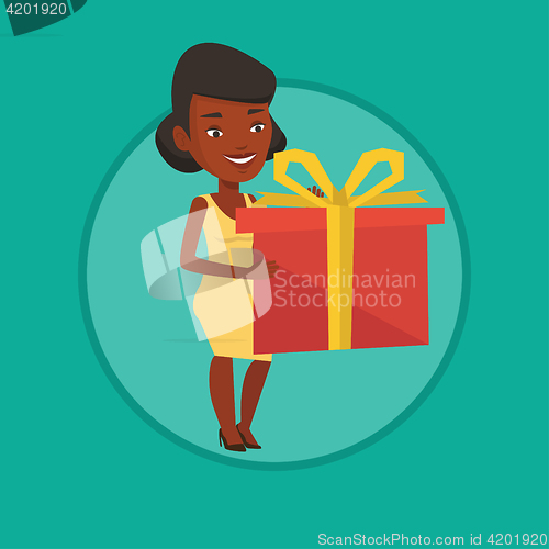 Image of African-american woman holding box with gift.