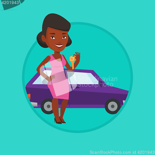 Image of Woman holding keys to her new car.