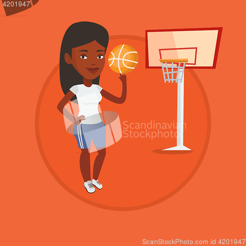 Image of Young basketball player spinning ball.