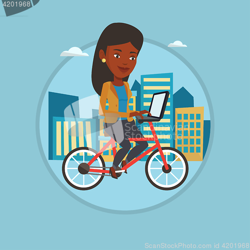 Image of Woman riding bicycle in the city.