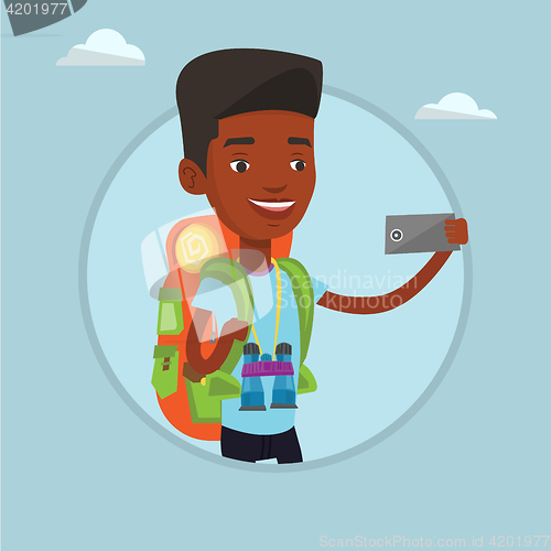 Image of Man with backpack making selfie.