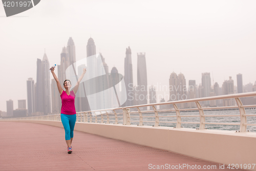 Image of young woman celebrating a successful training run