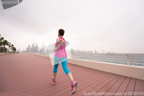 Image of woman running on the promenade