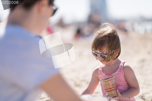 Image of Mom and daughter on the beach