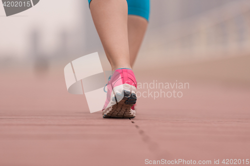 Image of woman running on the promenade