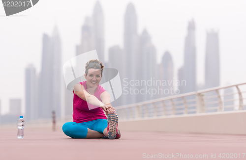 Image of woman stretching and warming up