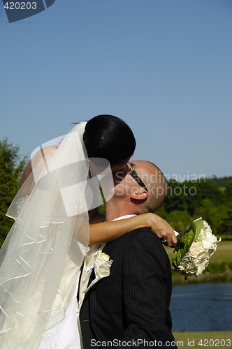 Image of Wedding couple kissing