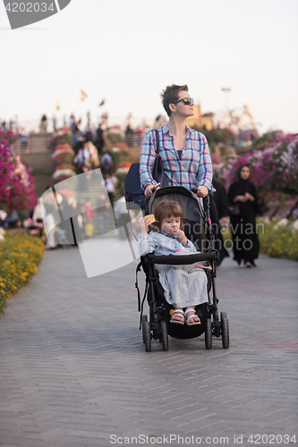 Image of mother and daughter in flower garden