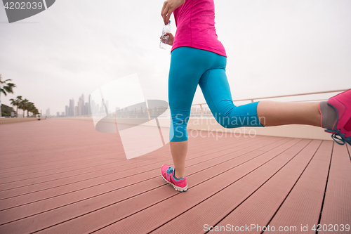 Image of woman running on the promenade