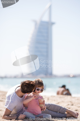 Image of Mom and daughter on the beach