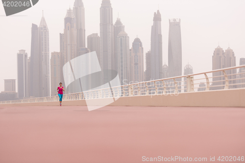 Image of woman running on the promenade