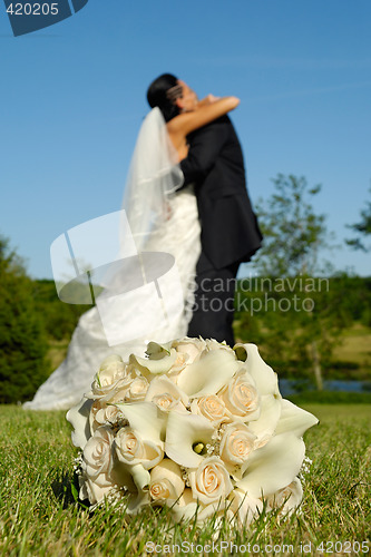 Image of Wedding bouquet and couple