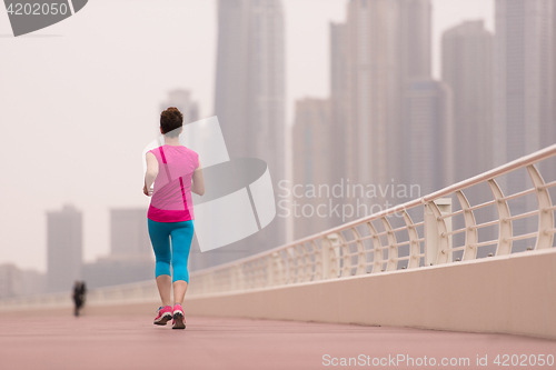 Image of woman running on the promenade