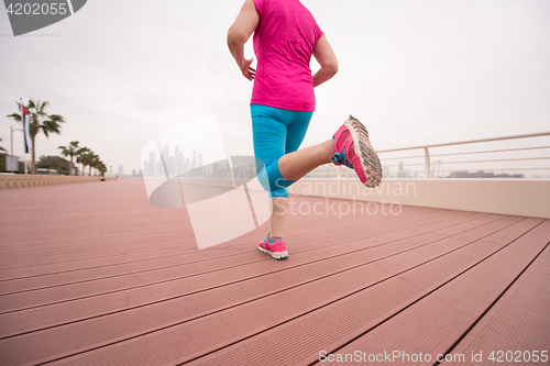 Image of woman running on the promenade