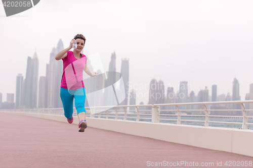 Image of woman running on the promenade