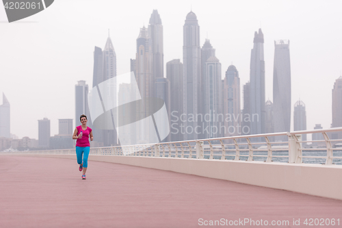 Image of woman running on the promenade