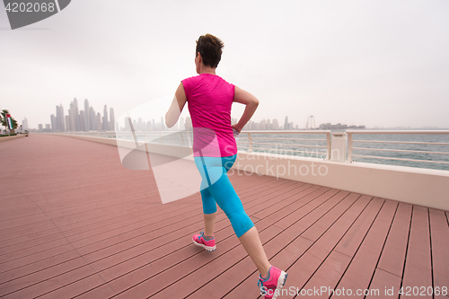 Image of woman running on the promenade