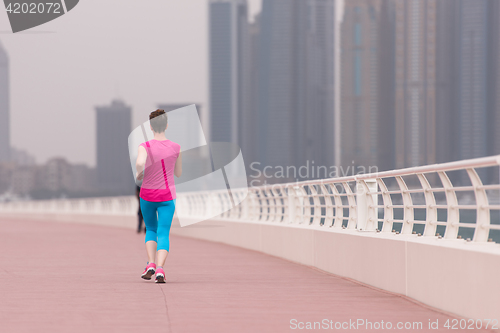 Image of woman running on the promenade