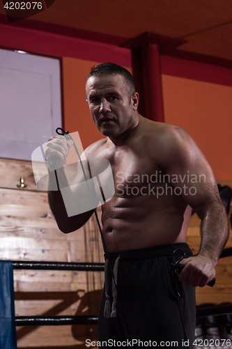 Image of professional kickboxer in the training ring