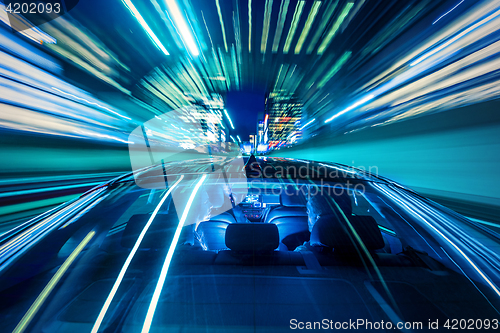 Image of Couple sitting in a car, heading for the big city