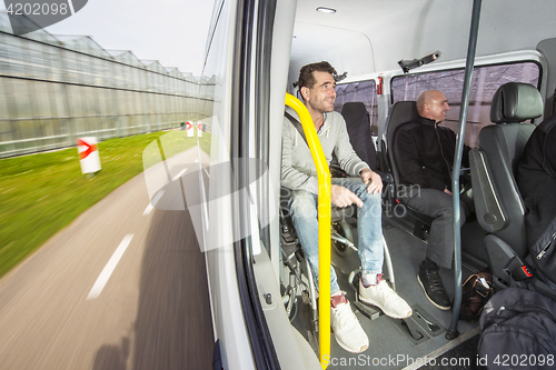 Image of Disabled passenger in a taxi bus