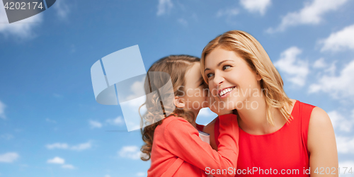 Image of happy mother and girl whispering into ear