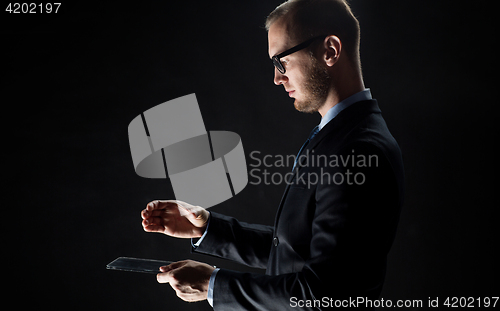 Image of close up of businessman with transparent tablet pc