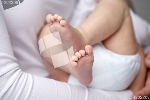 Image of close up of newborn baby in mother hands