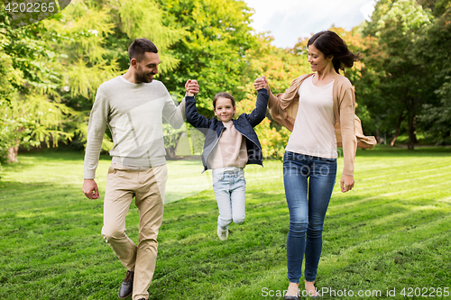 Image of happy family walking in summer park and having fun