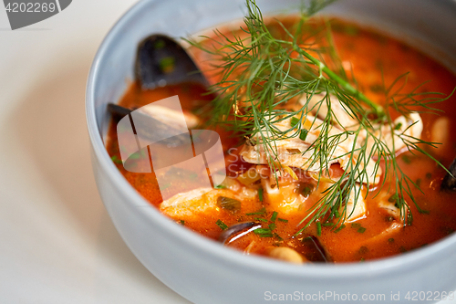 Image of close up of seafood soup with fish and mussels