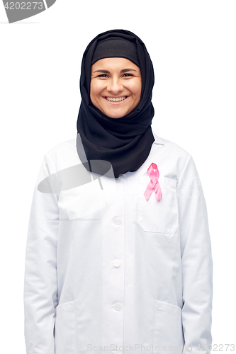 Image of muslim doctor with breast cancer awareness ribbon