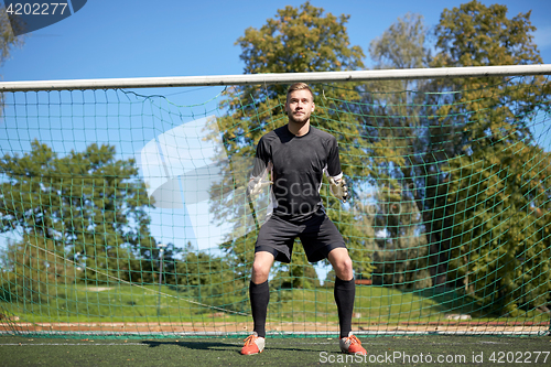 Image of goalkeeper or soccer player at football goal