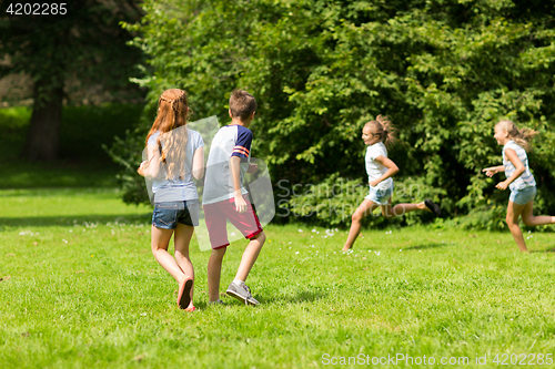 Image of group of happy kids or friends playing outdoors