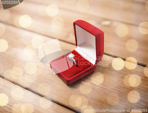 Image of close up of gift box with diamond engagement ring