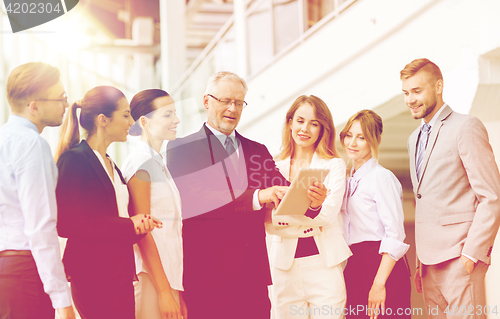 Image of business people with tablet pc computer at office