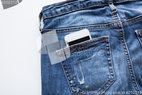 Image of smartphone in pocket of denim pants or jeans