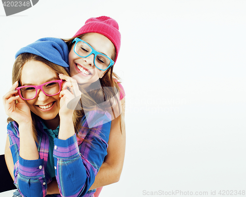 Image of lifestyle and people concept: Fashion portrait of two stylish sexy girls best friends, over white background. Happy time for fun. 