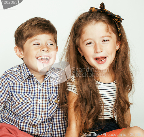 Image of little cute boy and girl hugging playing on white background, happy smiling family, lifestyle people concept 