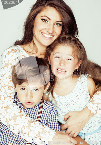 Image of two pretty children kissing their mother happy smiling close up, happy family, brother and sister, lifestyle people concept