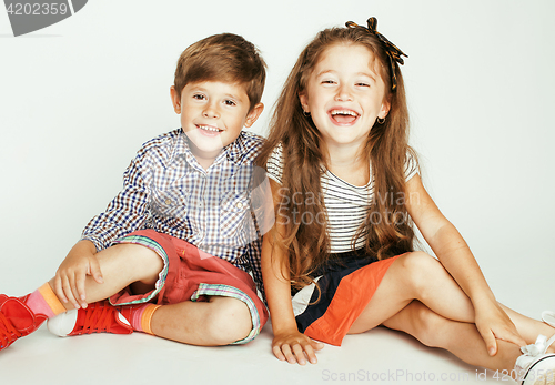 Image of little cute boy and girl hugging playing on white background, happy smiling family, lifestyle people concept 